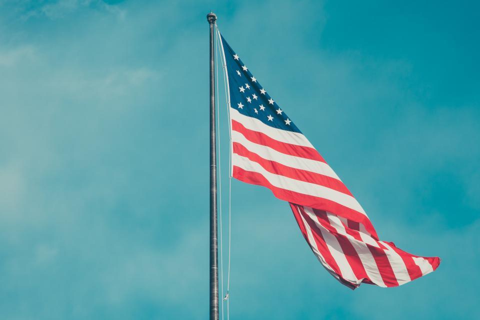 American flag flying against a clear sky